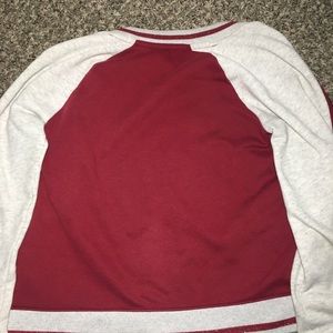 Kid’s maroon jacket.